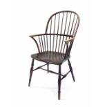 Elm seat Windsor armchair, the comb back upon turned supports, maker's stamp 'H.S', 21.5" wide,