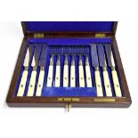 Mahogany cased set of twelve dessert knives and forks with ivory handles and plated blades