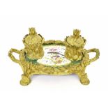 19th century French porcelain and ormolu twin-handled oval inkstand, with two covered inkwells