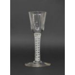 Antique cordial glass, the circular bell bowl on a clear air twist knop stem and circular foot, 6"