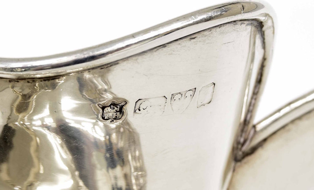 Edwardian silver jug with lion handle, of oval form repousse with a band of parading figures in a - Image 2 of 2