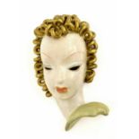 Goldscheider terracotta wall mask, modelled with golden ringlets, impressed number 8453 and