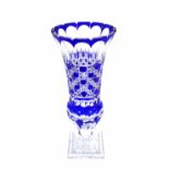 Large blue overlay cut glass vase, with a facet cut rim and hobnail cut body upon a square stepped