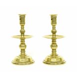 Pair of 18th century Heemskirk brass candlesticks, with turned stems, circular sockets and central