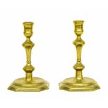 Pair of 18th century brass candlesticks, with double knop stems upon square canted bases, 7" high