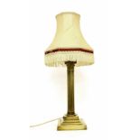 Corinthian style brass table lamp with shade, with a cast capital and reeded column upon a square