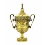 Fine silver-gilt twin handled trophy cup and cover, of campagna form, with entwined serpent