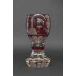 Masonic ruby overlaid glass goblet, with engraved emblems upon a knop and facet stem, 6" high