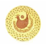 Early Staffordshire slip ware shallow circular wall charger, decorated in trail slip with a