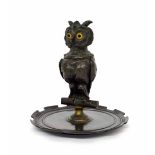 19th century bronze owl inkstand, modelled perched with a hinged head, inset glass eyes and white