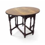 Small 18th century oak oval gate leg table, with baluster turned supports united with stretchers,