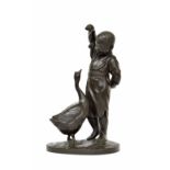 Japanese School - large bronze modelled as a standing child with a goose upon an oval naturalistic