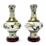 Good pair of cloisonne vases of slender bulbous form, decorated with orchids and blossoming trees on