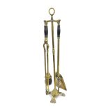 Brass fire companion set on stand, with turned ebony handles, 25.5" high