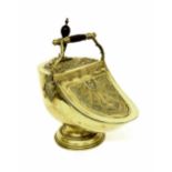 Good 19th century neoclassical style embossed brass coal helmet and shovel, with a fixed turned