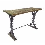 Rectangular garden table, the later plank top upon a black painted pierced wrought iron base