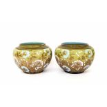 Pair of Doulton & Slaters stoneware ovoid vases, with floral designs in white and turquoise with