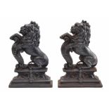 Pair of 19th century cast iron doorstops in the form of seated Heraldic Lions, 15" high (2)