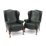 Pair of Kensington Standard leather fireside chairs by Sherborne, with antique green leather