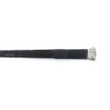 Ceremonial ebonised stick with carved fluted tapering handle and white metal mounts, 39" long