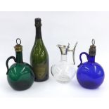 19th century green glass decanter and stopper, a similar blue glass decanter (at fault); also a '