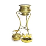 Polished repousse brass jardiniere on a stand, decorated with floral garlands over a reeded base, 8"