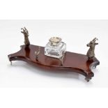 Decorative silver and mahogany serpentine inkstand, mounted with two cast silver stags' heads