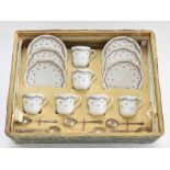 French Limoges porcelain boxed coffee set for six; together with a set of six silver spoons within a