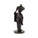 Chinese bronze figure modelled as a standing lady with a wide brimmed hat and a musical instrument