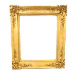 Large Victorian gilt plaster picture frame, decorated with foliate scrolls and motifs, rebate