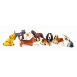 Collection of nine assorted dog ornaments, principally porcelain and pottery (9)