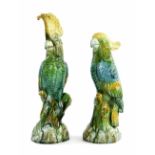 Two similar Majolica glazed pottery figures of parrots, the tallest 14.5"