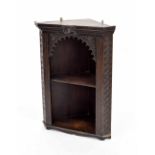 19th century Flemish style oak hanging corner wall shelf, with a carved mask over a carved arched