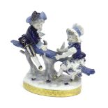 German porcelain group, modelled with children on a see-saw, in blue and white glaze upon an oval