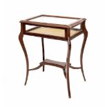 Edwardian walnut bijouterie display cabinet/table, the hinged rectangular shaped top inset with a