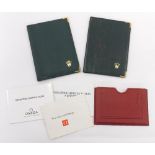Two Rolex green leather wallets; together with an Omega wallet with Omega booklets (3)