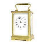 French carriage clock striking on a gong, within a corniche gilded brass case, 7" high (key)