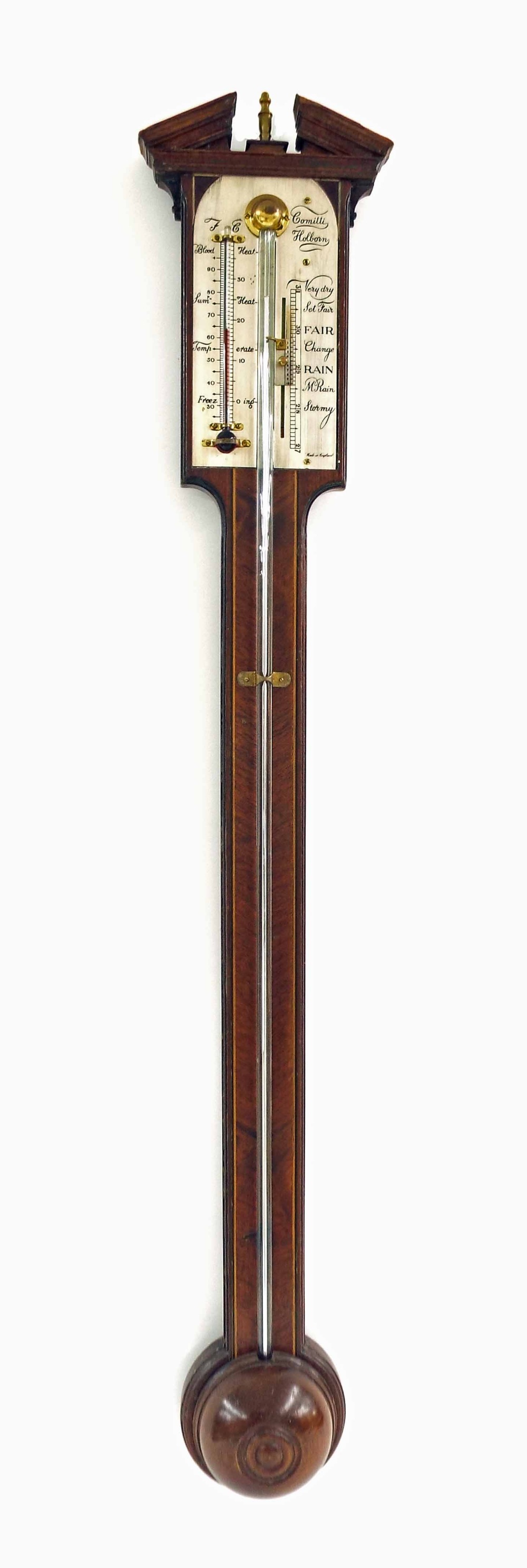 Mahogany inlaid stick barometer, the silvered scale signed Comitti, Holborn, over a flat trunk