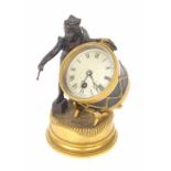Novelty bronze and ormolu drummer boy clock, the 2.5" silvered dial inset into a drum attended by