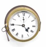 Brass ship's bulkhead wall clock, the 6" white dial with subsidiary seconds dial and slow/fast