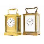 Carriage clock timepiece within a brass case, 6" high; also another brass carriage clock