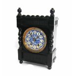 Arts & Crafts ebonised two train mantel clock striking on a gong, the 4.25" blue floral painted dial