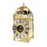 Good brass Eureka electric lantern clock, the 7.25" silvered chapter ring enclosing an inner ring