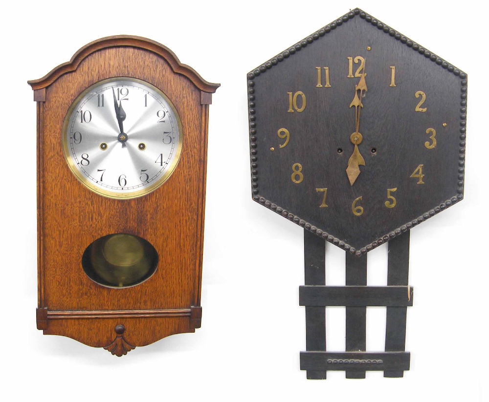 Oak cased two train wall clock, 19.25" high (pendulum and key); also an Arts & Crafts style dark