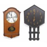 Oak cased two train wall clock, 19.25" high (pendulum and key); also an Arts & Crafts style dark