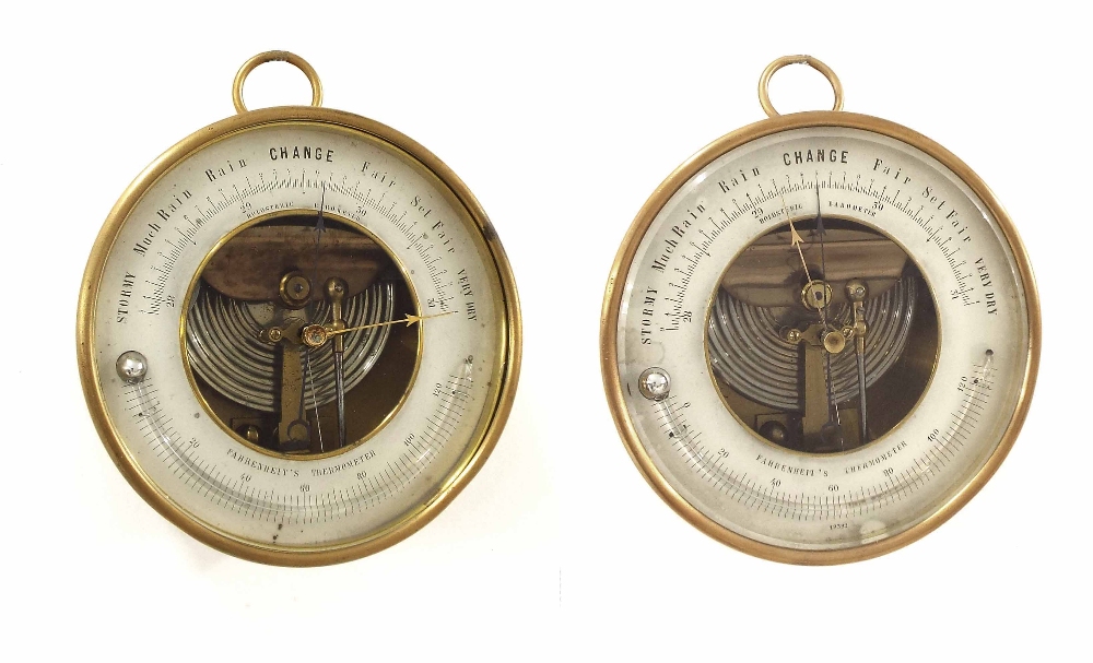 Two similar Holesteric circular brass cased barometers, each 4.75" diameter (2)