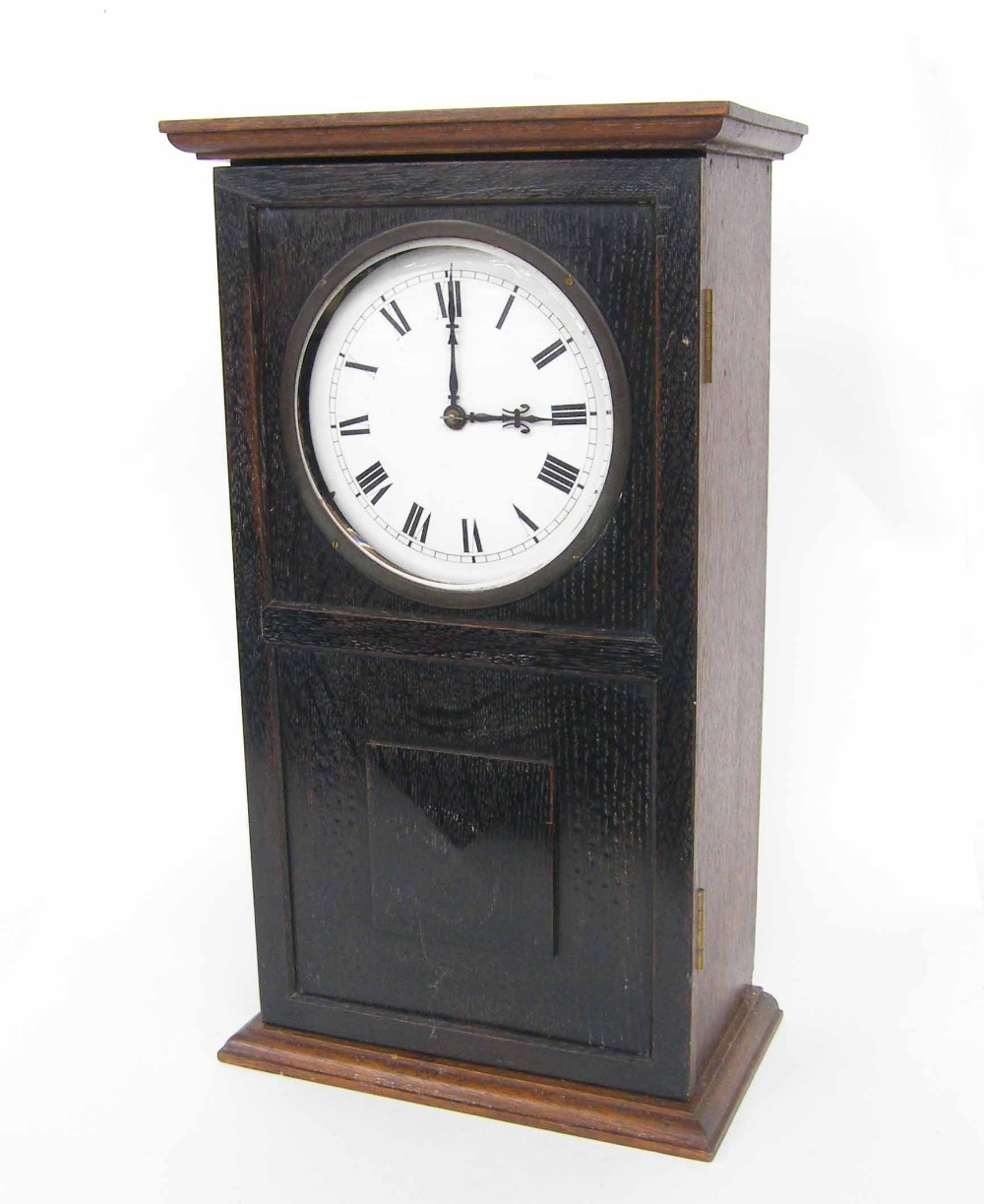 Reason MFG electric mantel clock, the 5.75" white dial within an oak stepped panelled case, 18" high