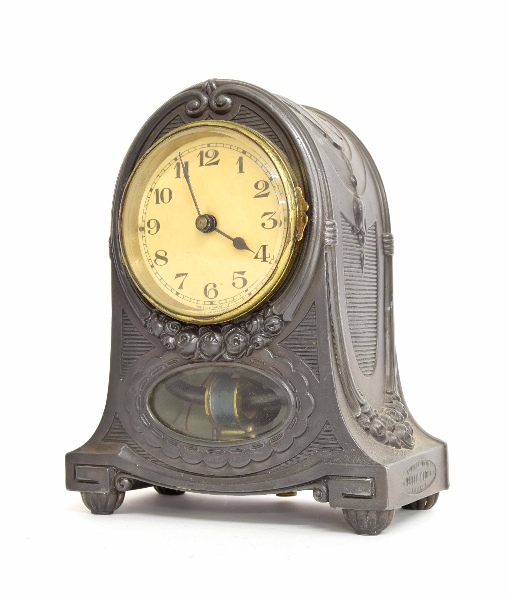 Unusual Bulle electric mantel clock, the 3.5" cream dial over an oval pendulum window and within a