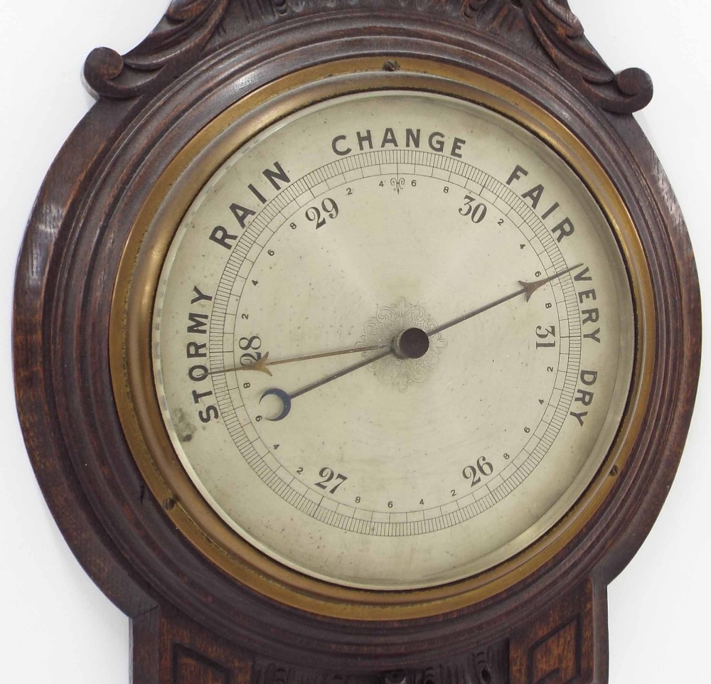 Oak banjo barometer/thermometer, the 8" silvered dial within a foliate carved case; also a novelty - Image 2 of 3