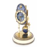 Kaiser torsion clock, the 3.25" cream chapter ring enclosing a celestial centre and surmounted by